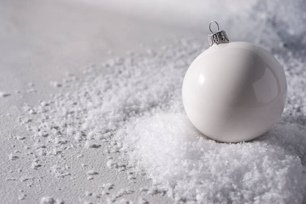 color christmas balls on a snow background