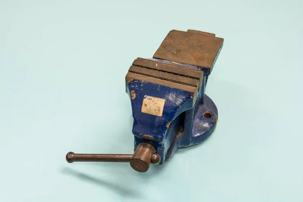 Blue steel vise on table background — Stock Photo, Image