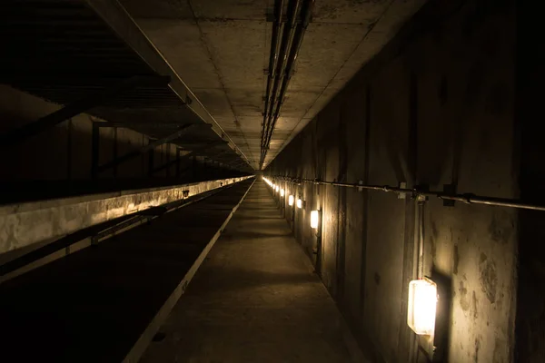 Underground tunnel with metallic pipes — Stock Photo, Image