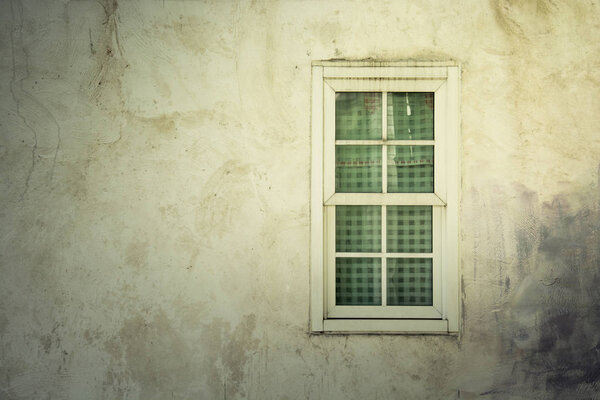 Light on Vintage window on nice color cement wall can be used for background, vintage color style