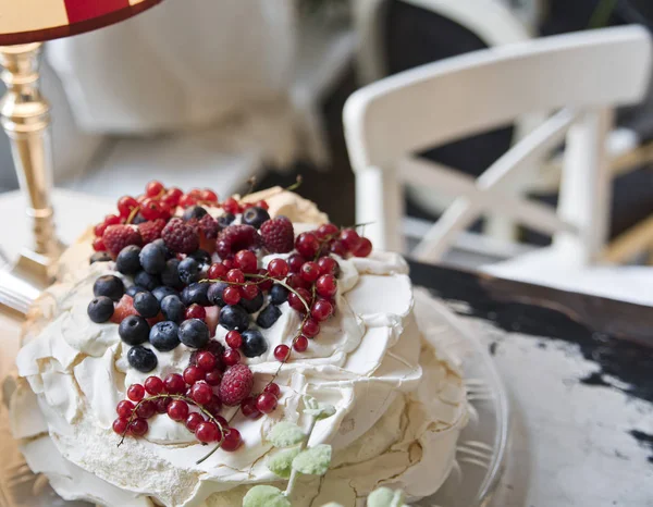 Cake meringues with berries. Delicious dessert. Copy space.