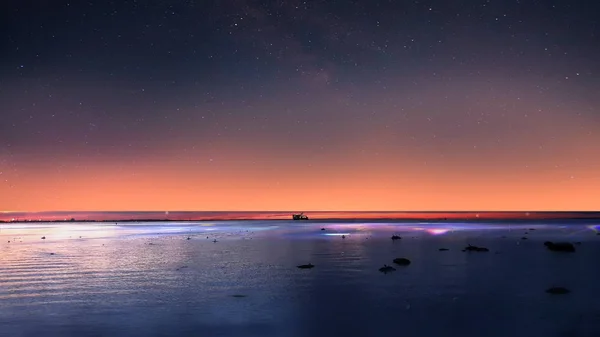 starry sky moon stars sunset summer night seascape city panorama night light reflexion on water harbor moon on blue sky Old town Tallinn Baltic sea