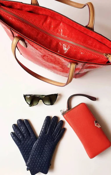 Women clothes accessories Leather gloves white jeans green black sunglasses  red purse wallet Blue White Jeans and  jumper Red Handbag girl fashion  luxury elegant concept on white background