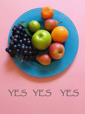 Fruits on background poster Fresh Eco Fruits Assortment  orange  lilac grape yellow  pear mandarin and green apple blue plate healthy fitness food diet  pink modern abstract concept background diet wishes quotes text  banner 