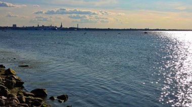  Sea blue and pink skyline  view at horizon ocean  water splash on harbor blue sky and clouds sun light, beach boat on ocean water splash birds fly sunset  holiday travel 