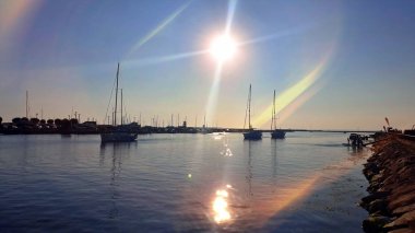  Sea blue and pink skyline  view at horizon ocean  water splash on harbor blue sky and clouds sun light, beach boat on ocean water splash birds fly sunset  holiday travel 