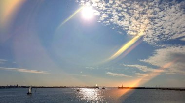  Sea blue and pink skyline  view at horizon ocean  water splash on harbor blue sky and clouds sun light, beach boat on ocean water splash birds fly sunset  holiday travel 