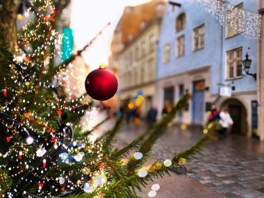 Christmas Tallinn Holiday city street light  Christmas tree decorated red balls illumination on ,people walking ,blurred blue red yellow light   ,urban winter scene ,travel to  Tallinn  Europe, 