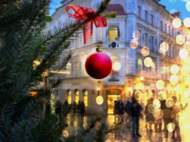 Christmas Tallinn Holiday city street light  Christmas tree decorated red balls illumination on ,people walking ,blurred blue red yellow light   ,urban winter scene ,travel to  Tallinn  Europe, 