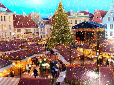 Christmas  Tallinn  marketplace In  old town square panorama   , full moon on night sky , tree light decoration , new year winter holiday in Europe blurred  light ,travel to Estonia,best  Christmas market in Europe 