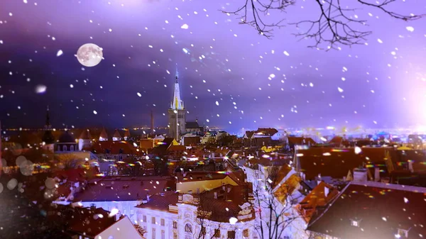 Christmas  Tallinn  marketplace In  old town square panorama   , full moon on night sky , tree light decoration , new year winter holiday in Europe blurred  light ,travel to Estonia,best  Christmas market in Europe