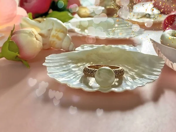 white pearl with seashell and roses petal ,Jewelry  background gold  white pearl rings with seashell and roses petal  on pink  background women accessories