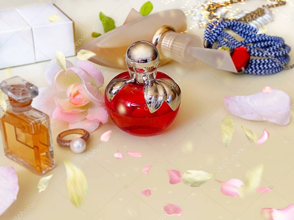 perfume bottle collection red and yellow with flowers petal on white background 