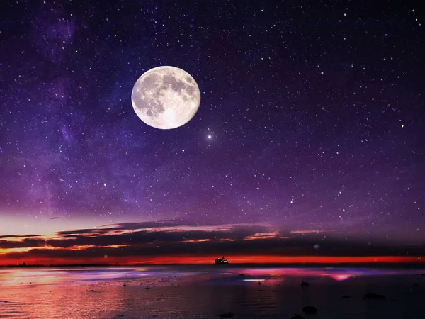 full moon on night starry sky at sea lilac pink sunset sky stars summer sea dark blue water reflection moonlight galaxy background nature