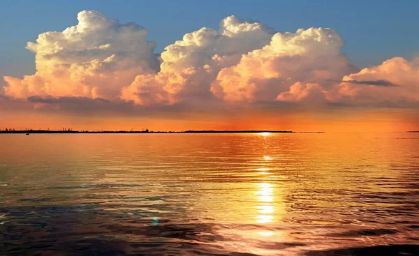 sunset at sea gold cloudy skyline and water wave reflection sunlight yellow blue nature landscape,gold sunset at sea cloudy skyline and water wave reflection sunlight yellow blue nature landscape beauty