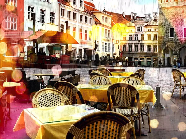 rainy evening in city street cafe tables and chair in European old medieval town Tallinn Estonia
