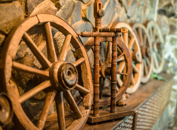 wooden wheel in a stone house