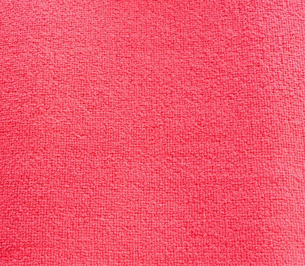 Fondo y textura de una alfombra roja — Foto de Stock