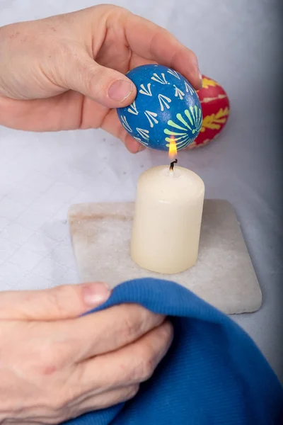 Women Hands Remove Candle Flame Wax According Sorbian Tradition Blue — Stock Photo, Image