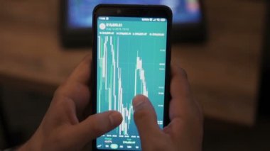 Block-chain, trading online, Cryptocurrency trend graph. Close-up Man touching screen, browse foreign exchange data, chart. Forex. Crypto currency. Bitcoin cryptocurrency. Candle graph. investment