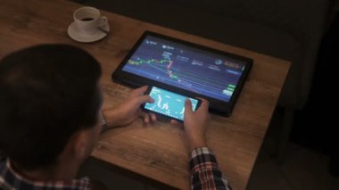 Block-chain, trading online, Cryptocurrency trend graph. Man at table touching screen. Forex. Crypto currency. Bitcoin cryptocurrency. Candle graph. investment