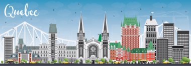 Gri binalar ve mavi gökyüzü ile Quebec manzarası.