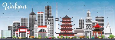 Wuhan manzarası gri binalar ve mavi gökyüzü ile.