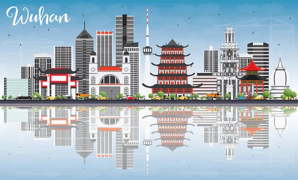 Wuhan manzarası ile gri binalar, mavi gökyüzü ve yansımaları.