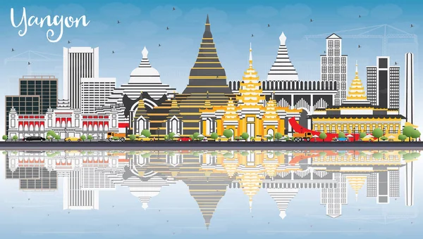 Yangon manzarası ile gri binalar, mavi gökyüzü ve yansımaları.