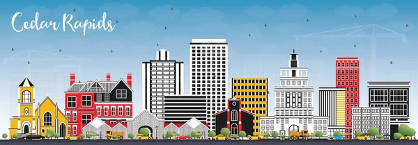 Cedar Rapids Iowa manzarası renkli binalar ve mavi gökyüzü ile.