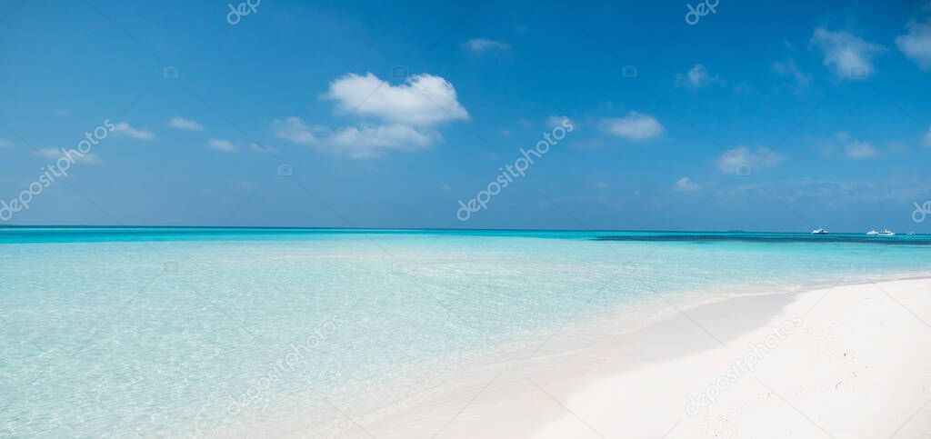 Tropical Beach with White Sand. Maldives Panorama. Idyllic Beach on Meeru Island with Cloudy Sky and Indian Ocean. 