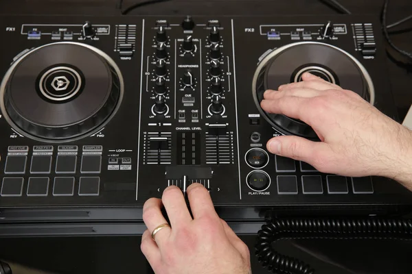 dj mixing the music. Music background, banner, card. Close-up. Modern technologies