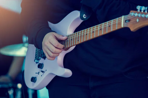 Musician's hands playing Electric guitar at a live show on stage — 스톡 사진