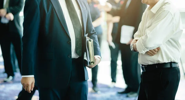 Business people wear suits and carry documents to walking and ta