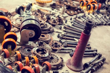 Many tools and old auto spare parts car at a car repair shop. Ca