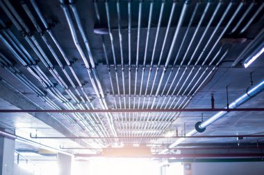 Blurry picture of electrical conduit and cabling. Blurry image f