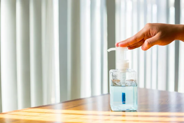 Washing hands with alcohol sanitizer to avoid contamination with Coronavirus Covid-19. Using alcohol gel clean wash hand sanitizer anti virus bacteria dirty skin care.