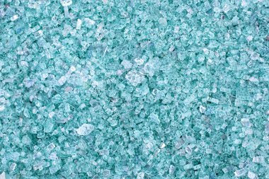 Fragments of blue glass. Small and sharp fragments of broken glass. cullet for creation of new glass are ready to be remelted. lot of particles of shattered glass. Garbage recycling. Ecology, trash clipart
