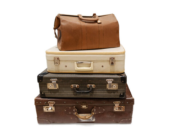 Pile of vintage Suitcases isolated on white background