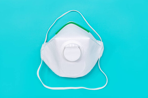 Safety mask FFP2 isolated on green background