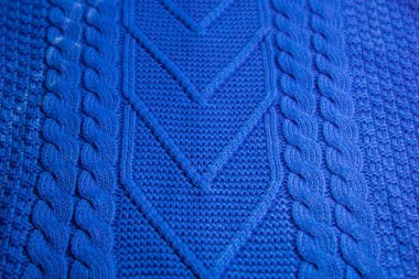 Renkli örgü süveter deseni yakın plan. El yapımı merino yünü ürünü. Örgü desenleri.