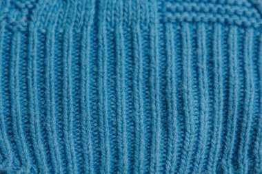 Renkli örgü süveter deseni yakın plan. El yapımı merino yünü ürünü. Örgü desenleri.