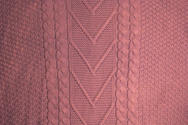 Pattern of colorful knitted sweaters closeup. Handmade merino wool product. Knitting patterns. — Stock Photo, Image
