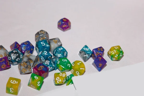 Polyhedral bone on the playing surface. This type of dice is used for role-playing games. — Stock Photo, Image