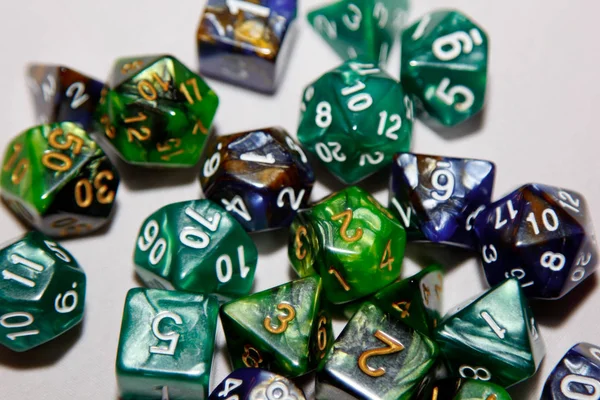 Dices for board games, dnd and rpg scattered on light surface. — Stock Photo, Image