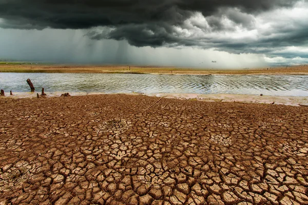 thunder storm sky Rain clouds Cracked dry land without wate