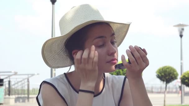 Beautiful Young Girl White Hat Paints Her Lips Red Lipstick — Stock Video