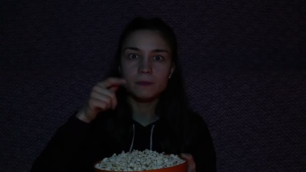 Young Girl Watching Eats Popcorn Young Beautiful Girl Sits Sofa — Stock Video