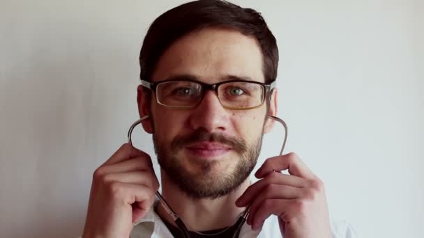 Young Handsome Doctor Wearing Glasses Takes Stethoscope Hangs His Neck — Stock Video