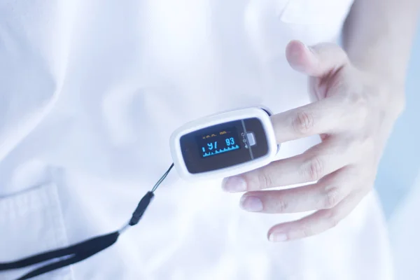 Blood pressure finger monitor — Stock Photo, Image